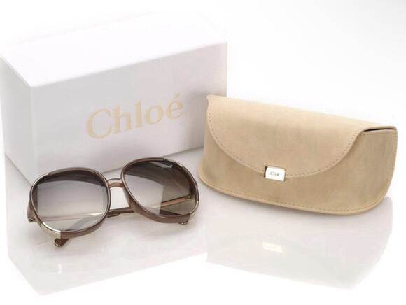 Chloé CE712S sunglasses feature a distinct brown and gold oversized round frame main image 8